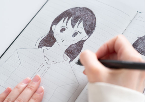 書いているシーン